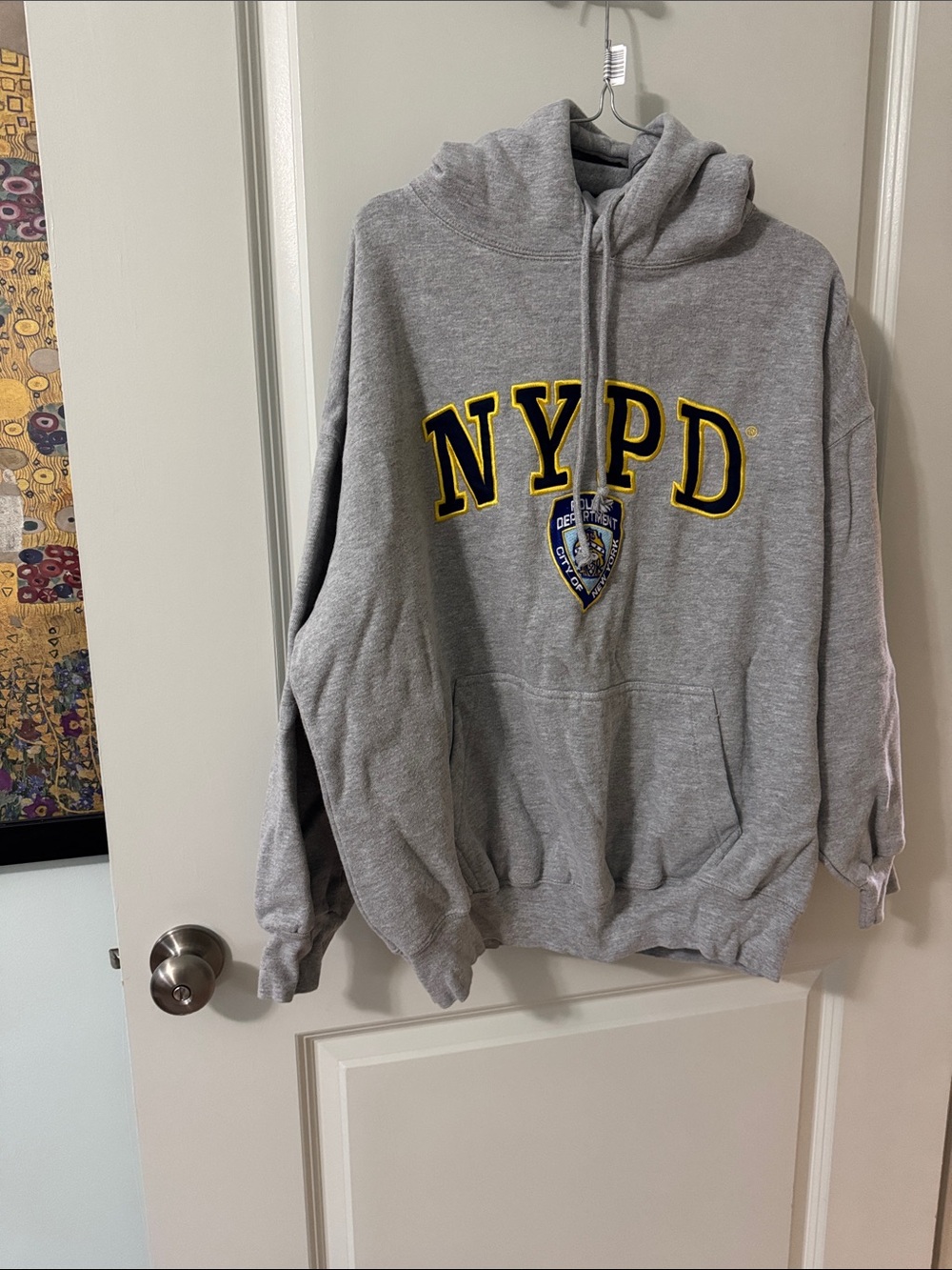 Grey Pullover Hoodie with Embroidered Crest